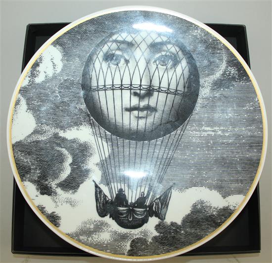 A collection of Fornasetti Temi e Variazioni and musical trophy pattern items,